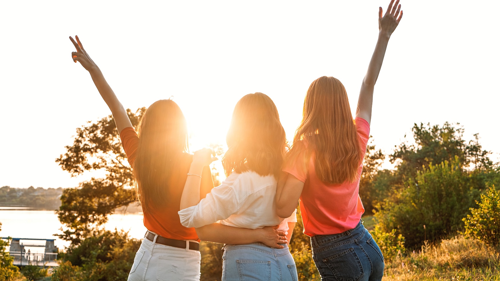 International Womens Day. Women, Female, Feminism, Friends, Girl power, diversity, femininity Concept. Group of three happy young women having fun outdoor.